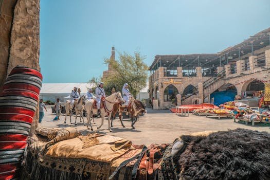 pexels-photo-2239422-2239422 Vibrant marketplace in Doha with traditional textiles and riders on horses. Captures Qatari culture.